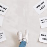 Inspirational health and fitness messages with shoe-clad feet, promoting healthy habits and wellbeing.
